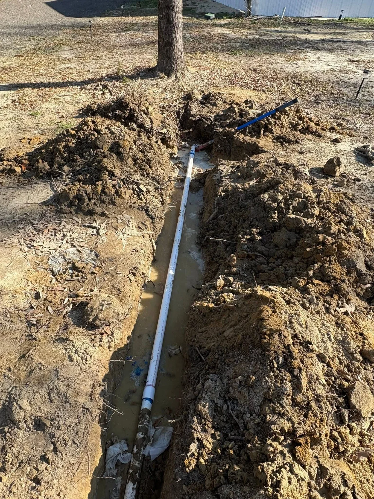 Open trench with a line installed by M.U Services